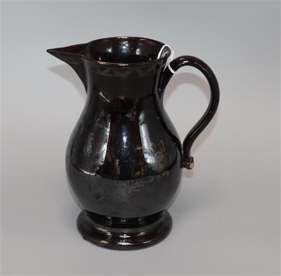 An 18th century Jackfield pottery baluster jug height 19cm